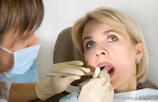 woman recieves dental work from dentist