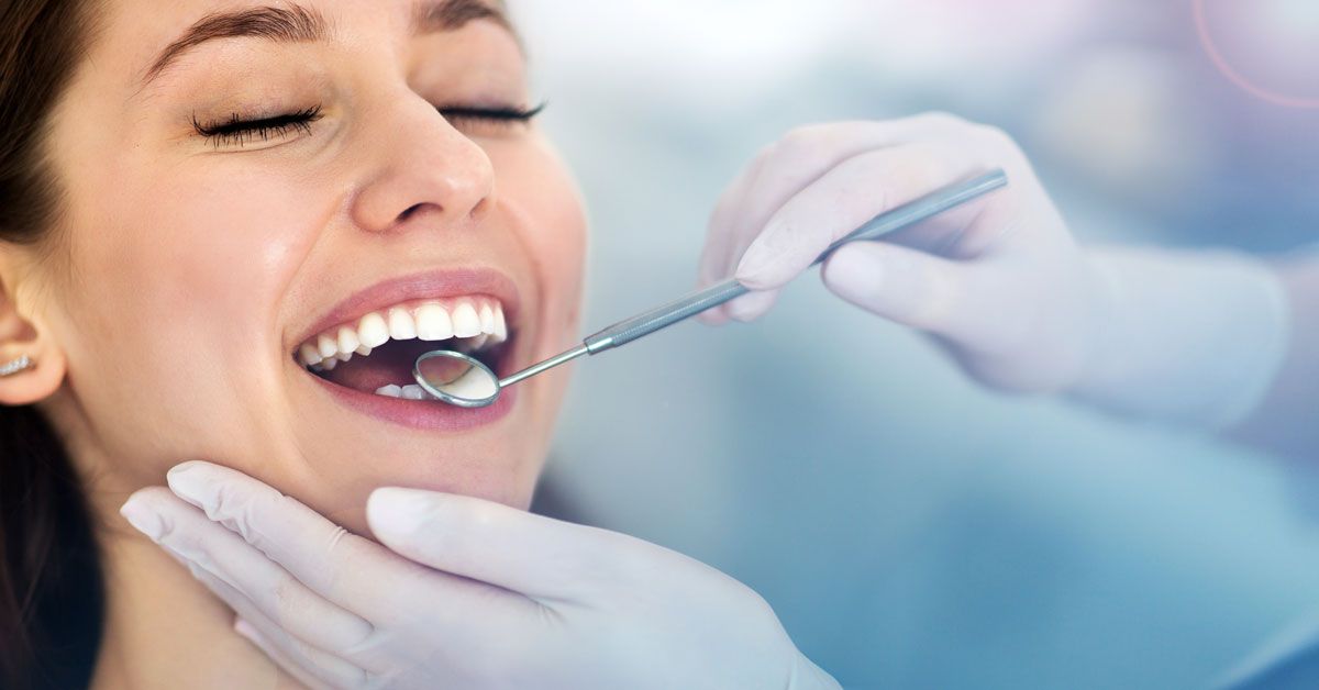 red headed woman receives dental work 
