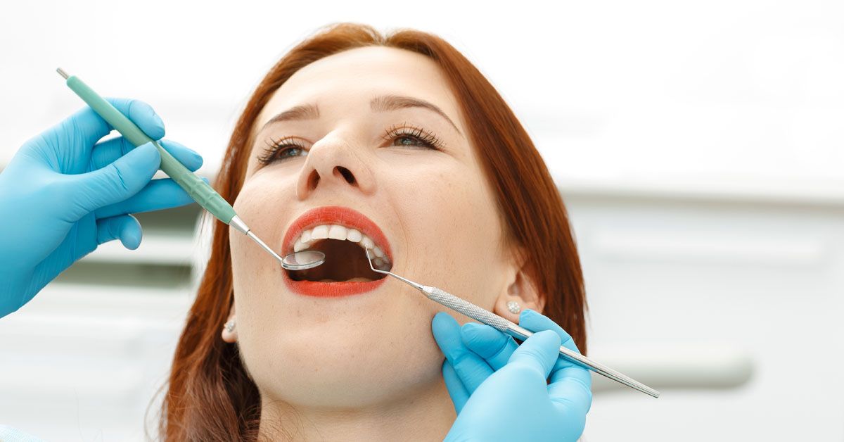 cosmetic dentist patient in chair