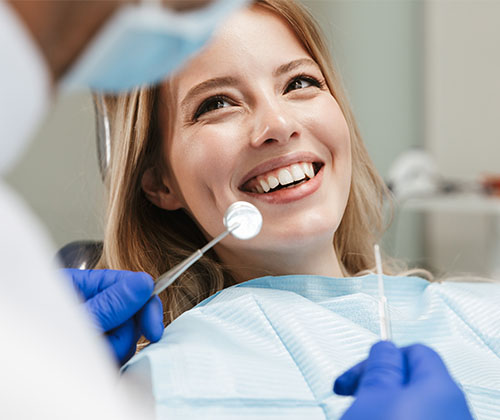 dental patient smiling at dentist in marco island